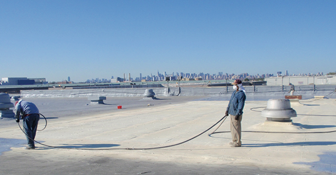 Protective roof coating sprayed over SPF